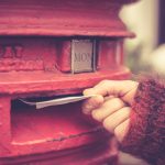 Woman posting letter